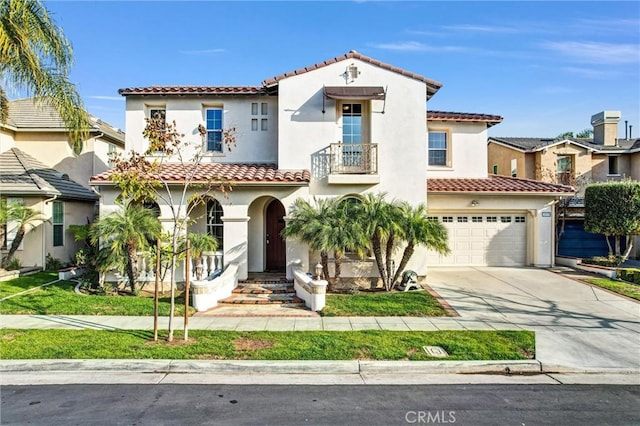 mediterranean / spanish house with a garage