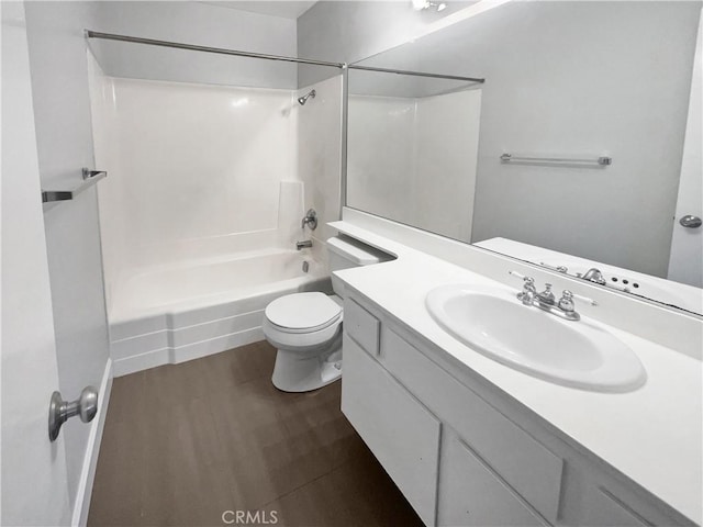 full bathroom featuring vanity, hardwood / wood-style floors, tub / shower combination, and toilet