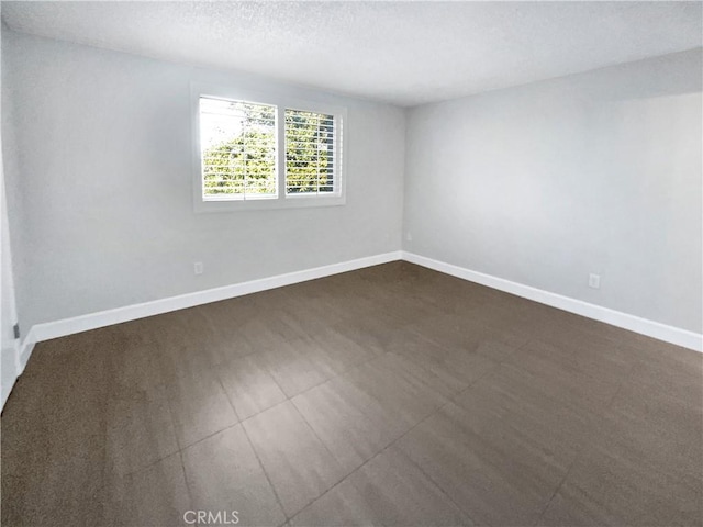 empty room with a textured ceiling