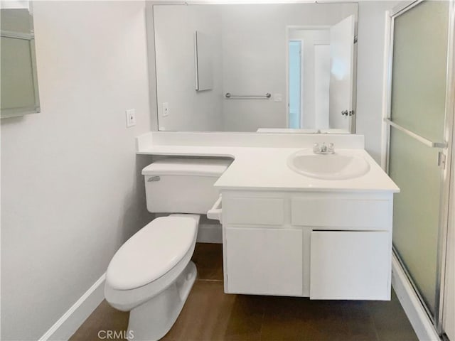 bathroom with vanity, toilet, and walk in shower