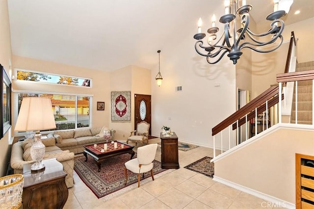 living room with an inviting chandelier, a towering ceiling, and light tile patterned floors