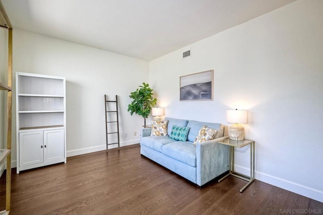 living room featuring dark wood-type flooring