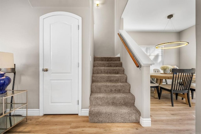 stairway with wood-type flooring