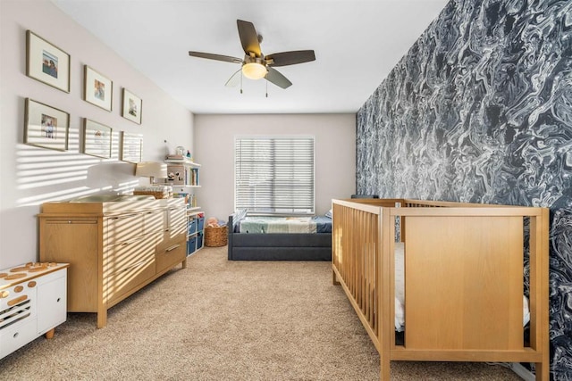 bedroom with light carpet and ceiling fan