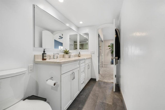 bathroom featuring vanity and toilet