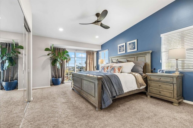 carpeted bedroom featuring ceiling fan, lofted ceiling, and access to outside