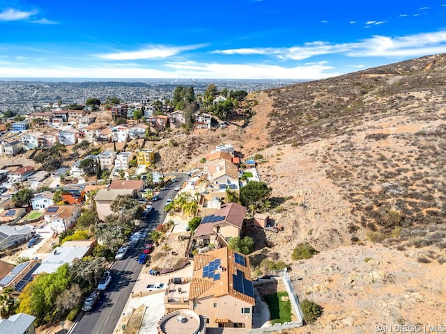 birds eye view of property with a mountain view