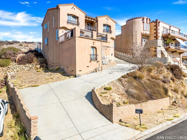 view of front of property with a balcony