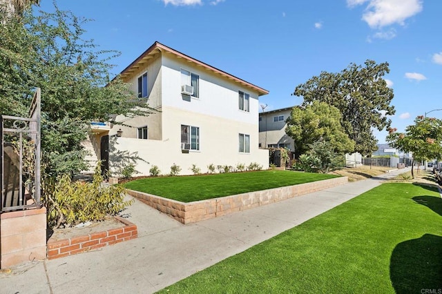 view of property exterior featuring cooling unit and a yard