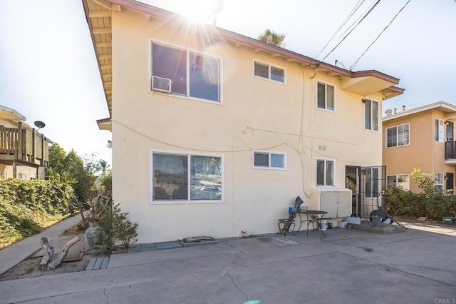 rear view of property featuring a patio