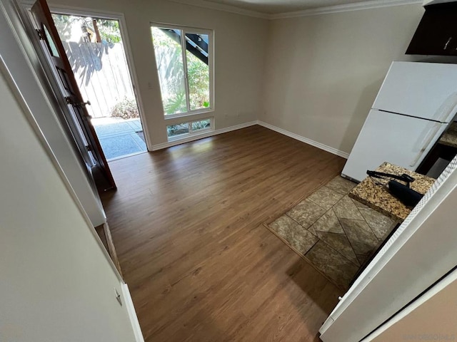 interior space featuring ornamental molding and hardwood / wood-style floors