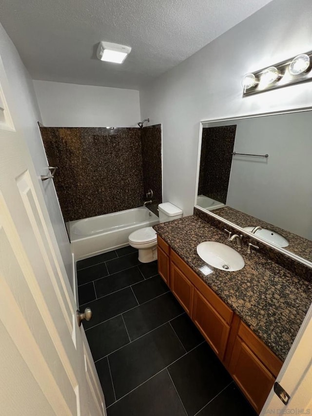 full bathroom featuring toilet, a textured ceiling, shower / tub combination, vanity, and tile patterned flooring