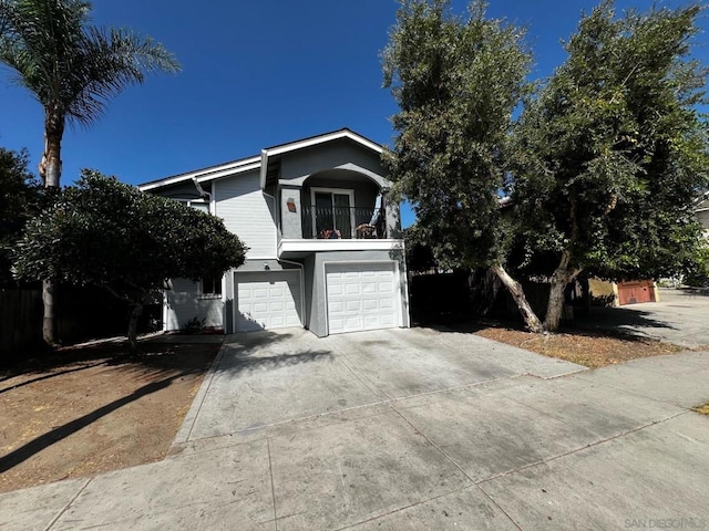 view of front property with a garage and a balcony