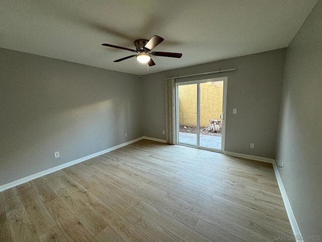 empty room featuring light wood-type flooring and ceiling fan