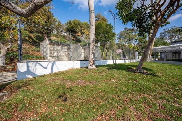 view of yard featuring basketball court