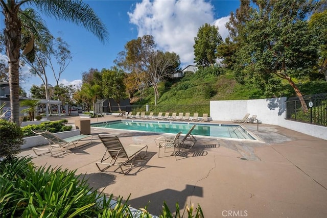 view of swimming pool featuring a patio