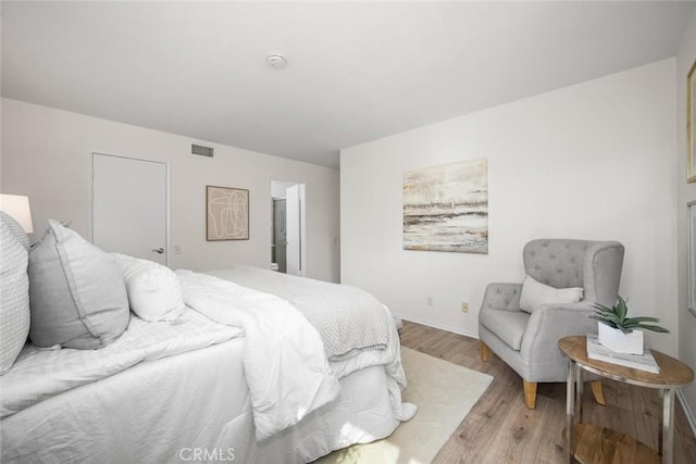 bedroom with light hardwood / wood-style floors