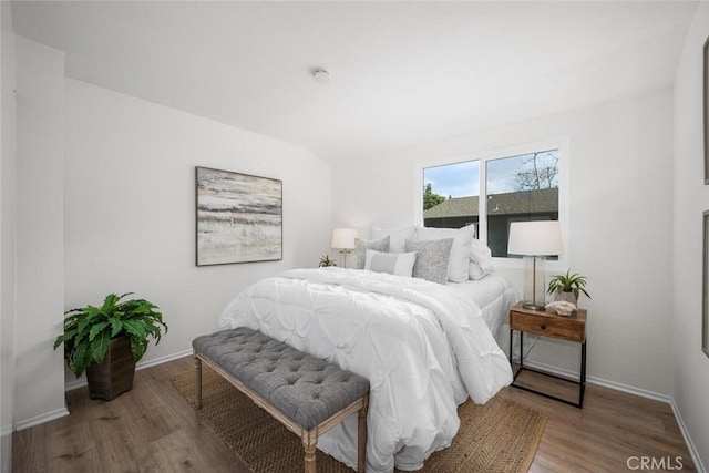 bedroom with hardwood / wood-style flooring