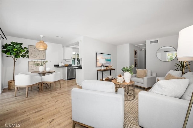 living room with light hardwood / wood-style floors