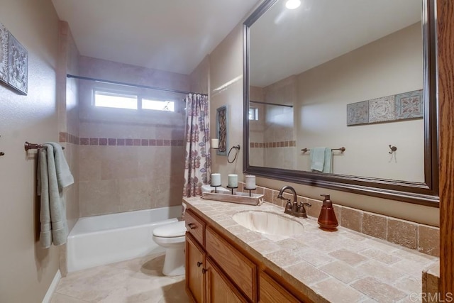 full bathroom with tile patterned floors, vanity, toilet, and shower / bath combo