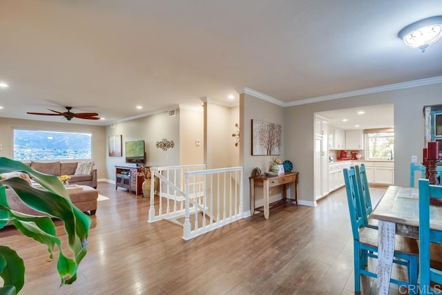 interior space with crown molding and wood-type flooring