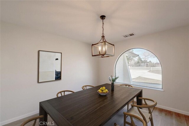 dining space featuring hardwood / wood-style flooring