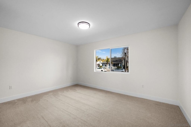 unfurnished room featuring carpet flooring