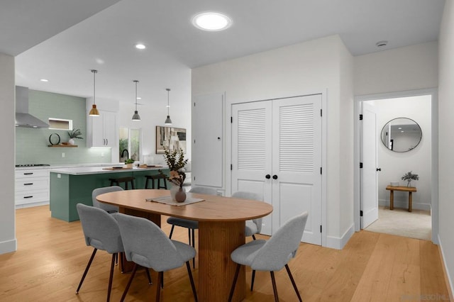 dining space featuring light hardwood / wood-style flooring