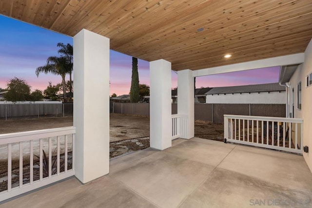 view of patio terrace at dusk