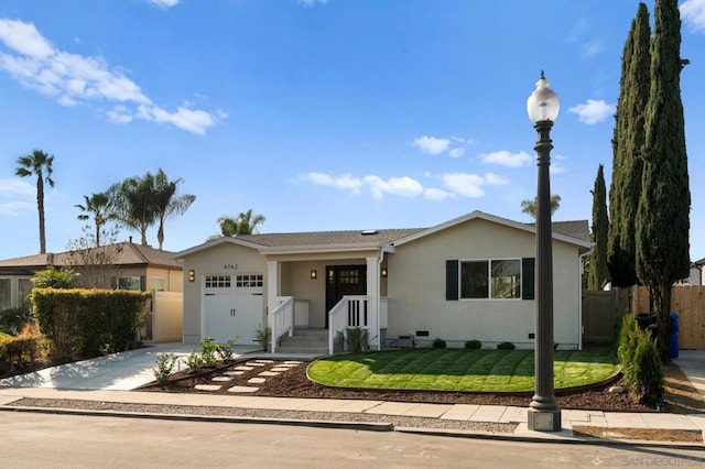 single story home featuring a garage and a front lawn