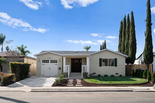 ranch-style home with a garage and a front yard