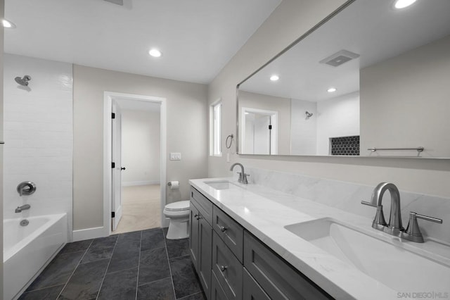 full bathroom with shower / tub combination, vanity, toilet, and tile patterned flooring