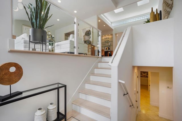 stairway featuring tile patterned floors