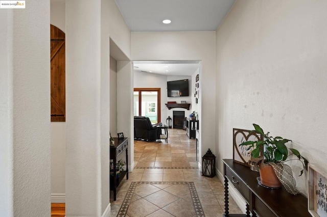 hall with light tile patterned flooring