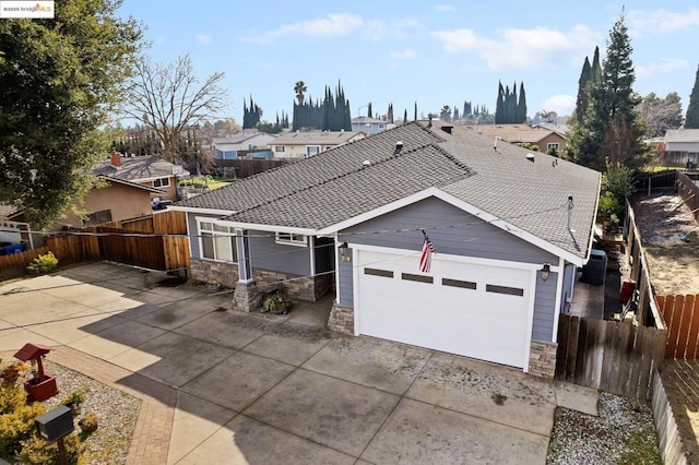 single story home with a garage and a patio area