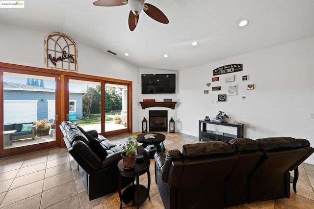 tiled living room with lofted ceiling and ceiling fan