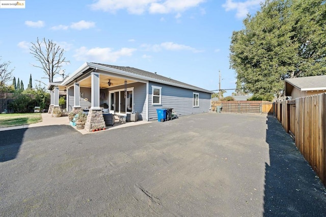 back of house with a patio area and ceiling fan