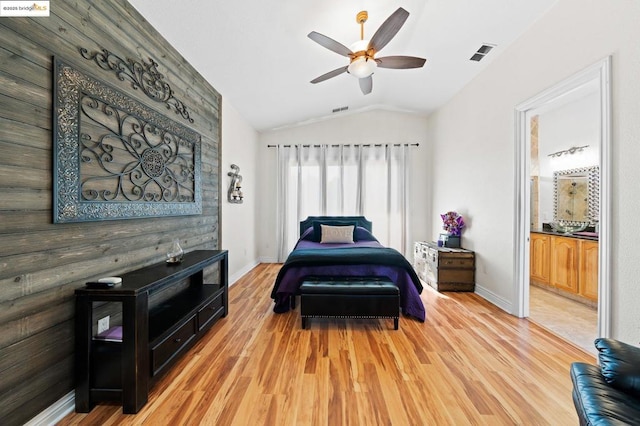 bedroom featuring ceiling fan, lofted ceiling, and light hardwood / wood-style floors