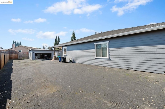 view of home's exterior with an outbuilding and a garage