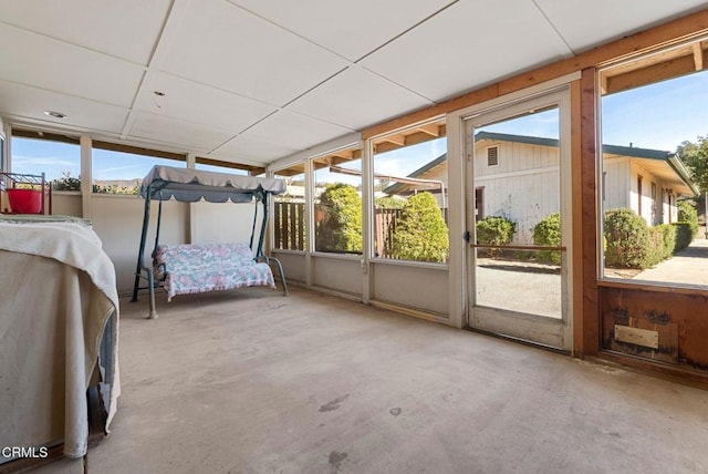 unfurnished sunroom with plenty of natural light