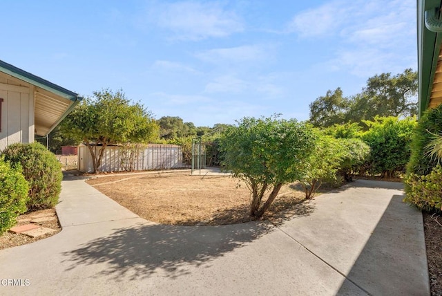 view of yard with a patio and fence