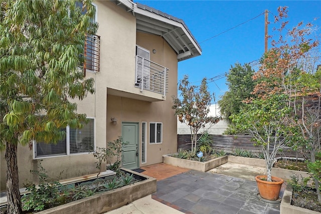 rear view of property featuring a patio area