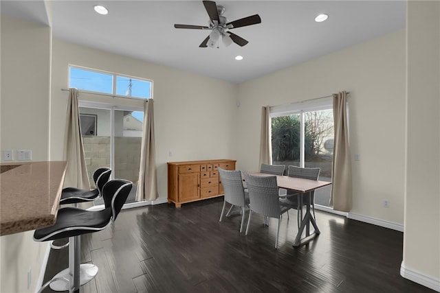 dining area featuring dark wood-type flooring and ceiling fan