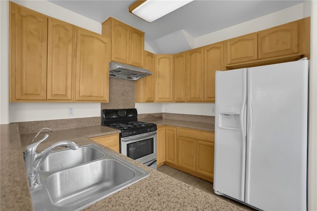 kitchen with sink, white refrigerator with ice dispenser, light tile patterned floors, gas range, and light brown cabinets