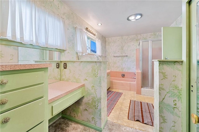 bathroom with independent shower and bath, vanity, and tile patterned floors