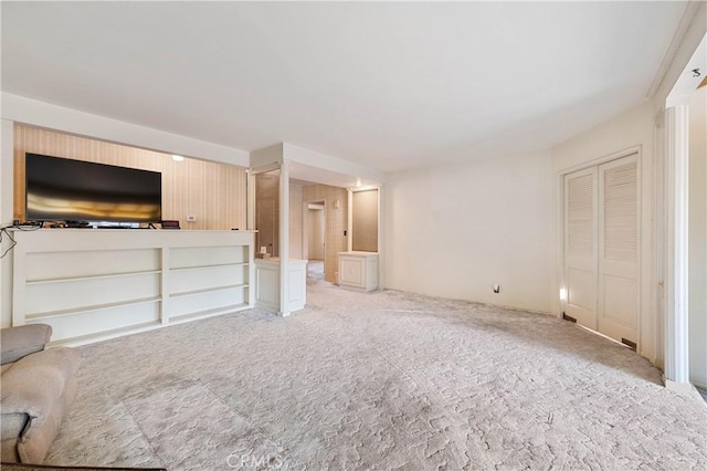 unfurnished living room with light carpet