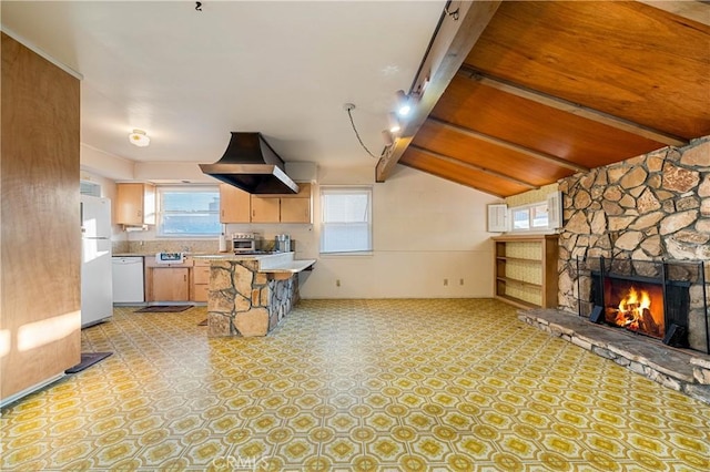 kitchen with white appliances, a fireplace, a kitchen breakfast bar, and lofted ceiling with beams