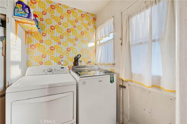 clothes washing area featuring washing machine and clothes dryer