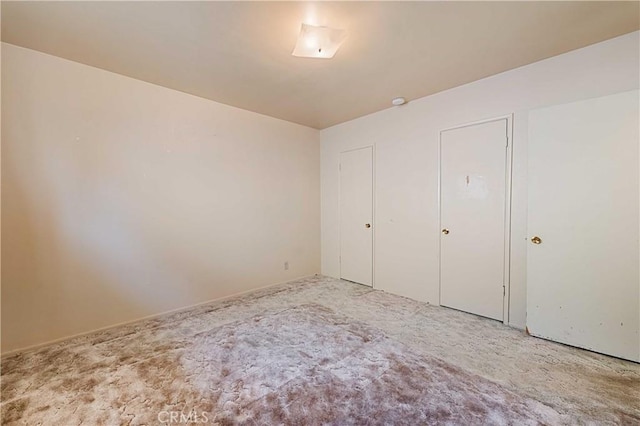 unfurnished bedroom featuring carpet floors