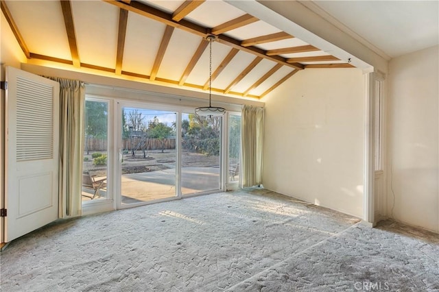 unfurnished living room with lofted ceiling